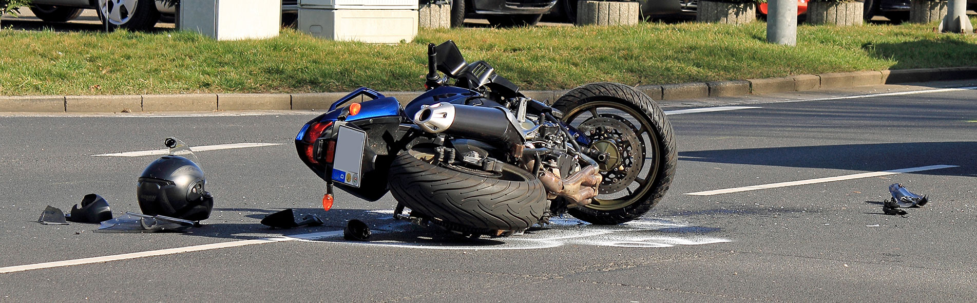 A motorcycle crashed in the middle of the road