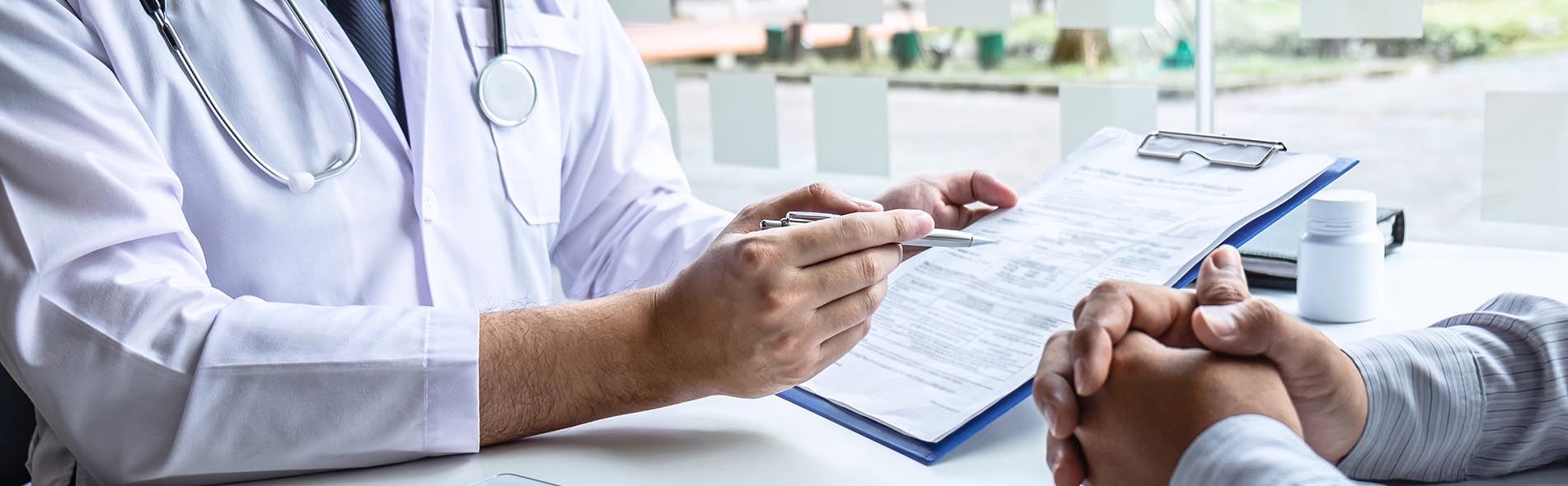 A doctor discussing a diagnosis with a patient in which they fail to diagnose a serious condition