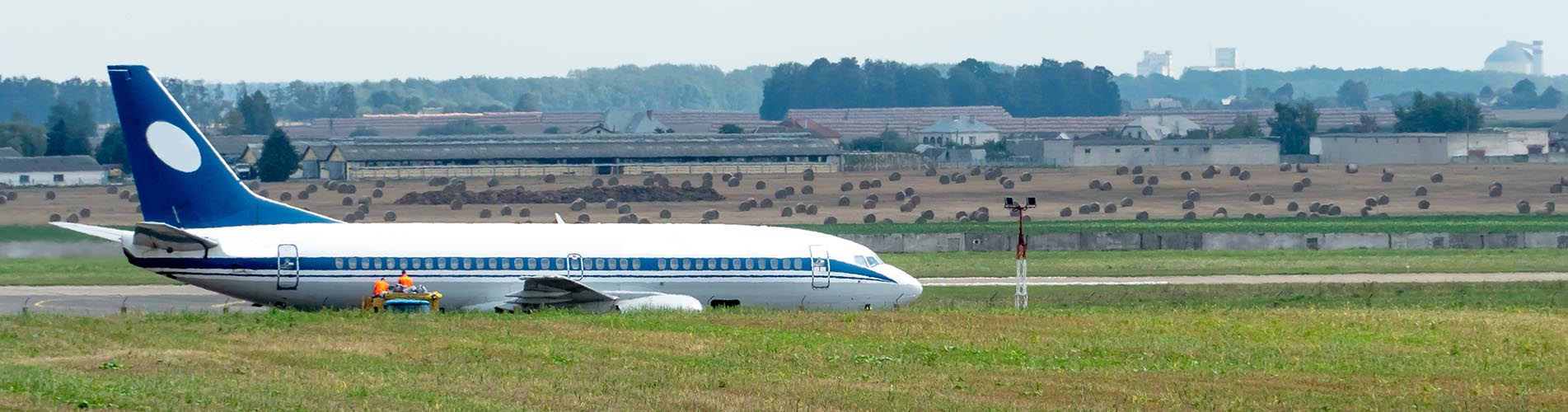 The plane is on the runway. Maintenance of the aircraft after an emergency landing. Preparing an airliner for takeoff.