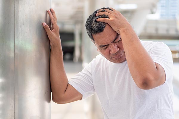 sick asian senior man suffering from vertigo headache; mental sickness concept for vertigo, dizziness, stress, depression, burnout, Alzheimer, brain cancer, Meniere disease, memory loss; old man model