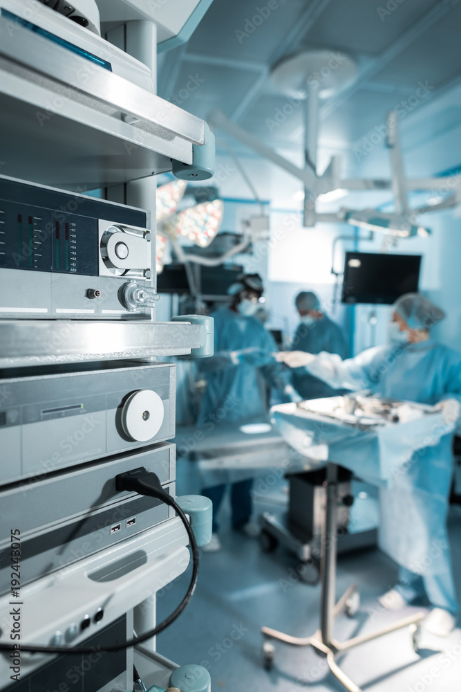 Surgeons operating on a patient who has suffered from a hospital infection