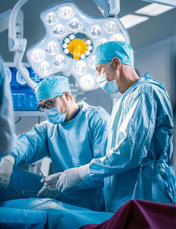 Shot In Operating Room of Two Surgeons During the Surgery Proced